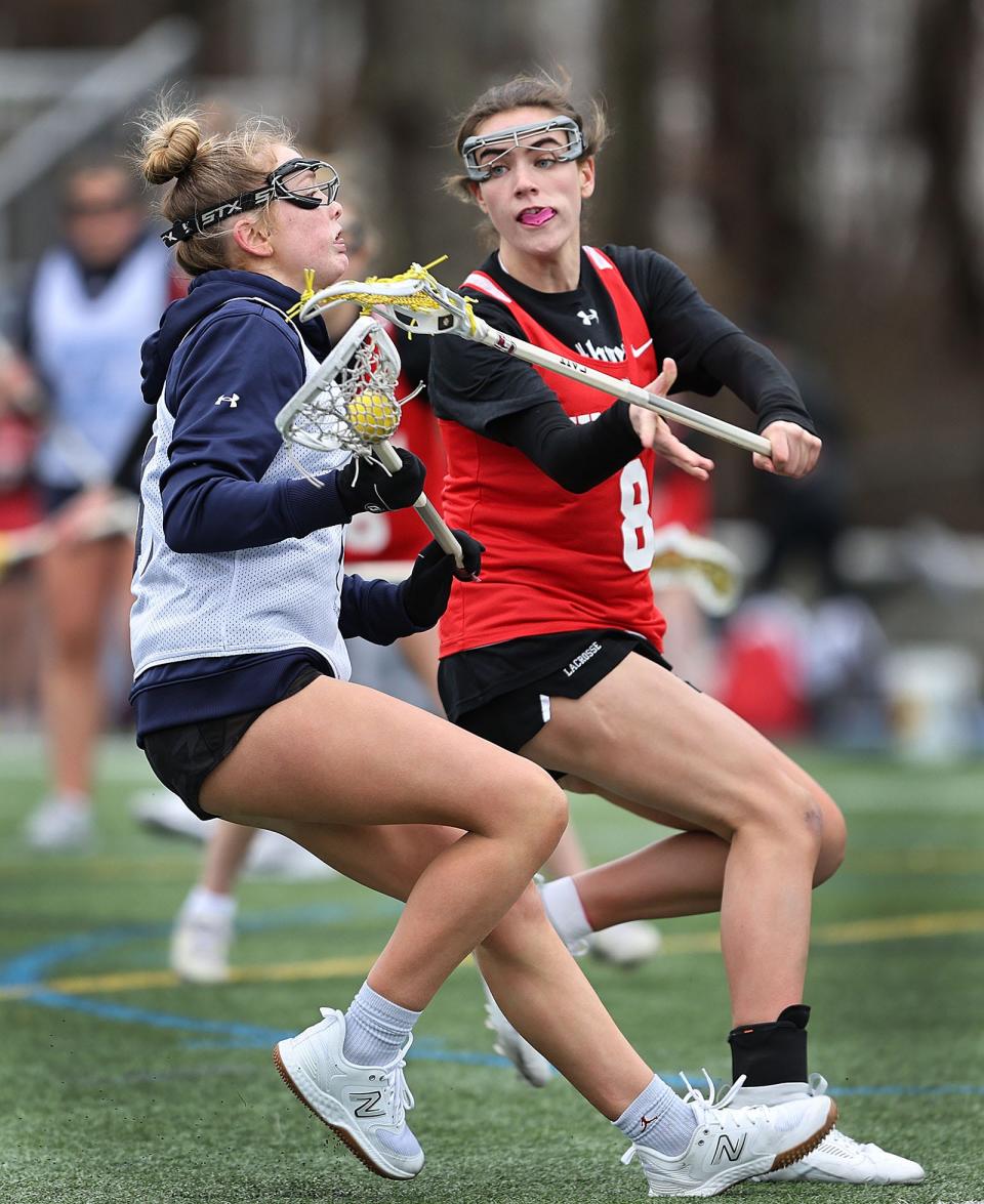 Hingham's Caroline Connolly tries to block the advance of Scituate #41 Kate Stone.
Scituate host Hingham girls lacrosse for a pre-season scrimmage on Friday March 29, 2024