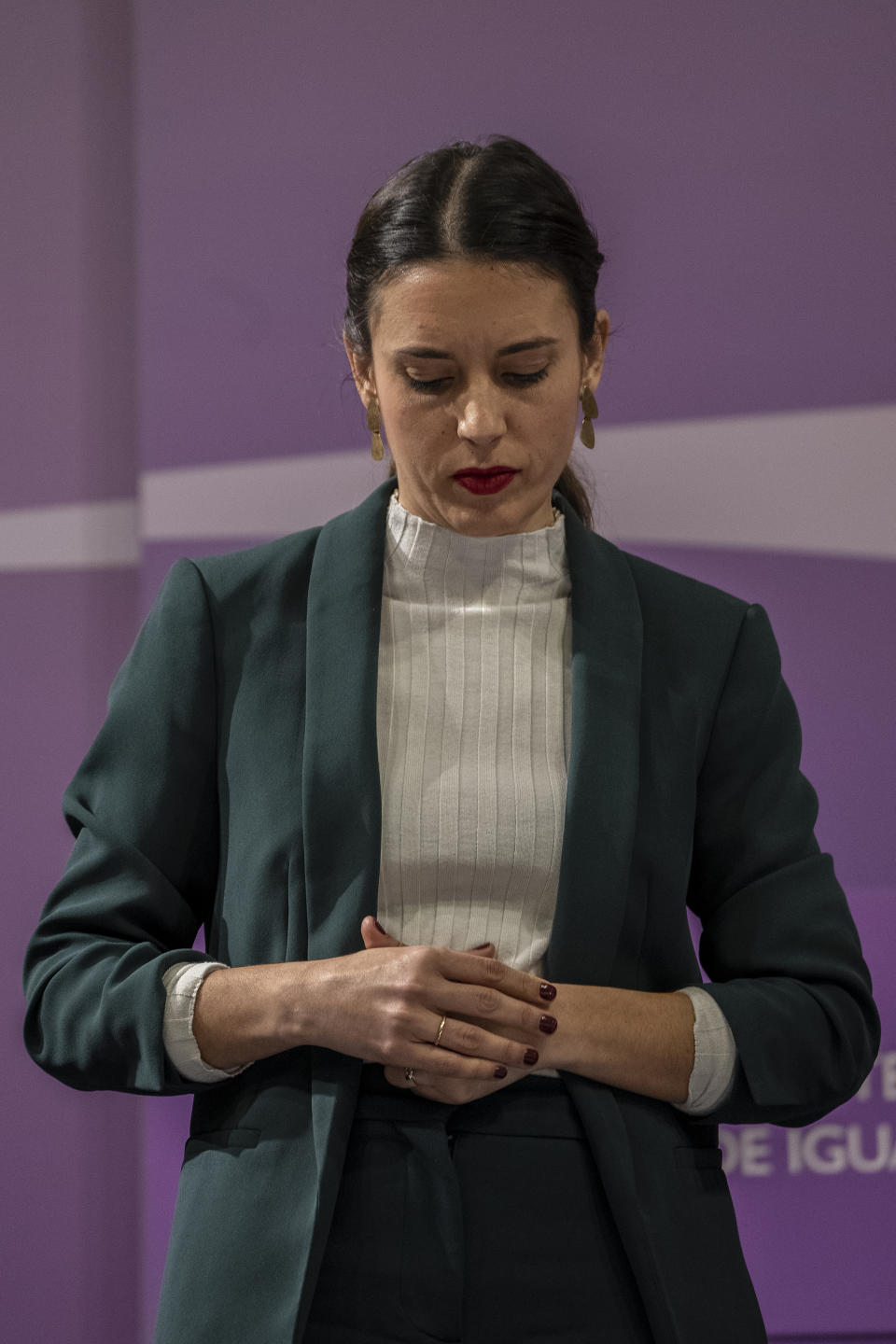 Spain's Equality Minister Irene Montero looks down during a press conference after an emergency meeting for a worrying surge of gender violence in Madrid, Spain, Friday, Jan. 27, 2023. A spate of gender-based violence, coupled with the early release of sex offenders, has increased pressure on Spain's left-wing government, which strongly plays up its feminist credentials, to do more to protect women from abuse. (AP Photo/Manu Fernandez)