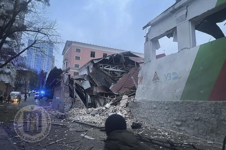 In this photo provided by the Kyiv Regional Military Administration, debris of a destroyed apartment building is seen after a Russian attack in Kyiv, Ukraine, Tuesday, Jan. 23, 2024. (Kyiv Regional Military Administration via AP)