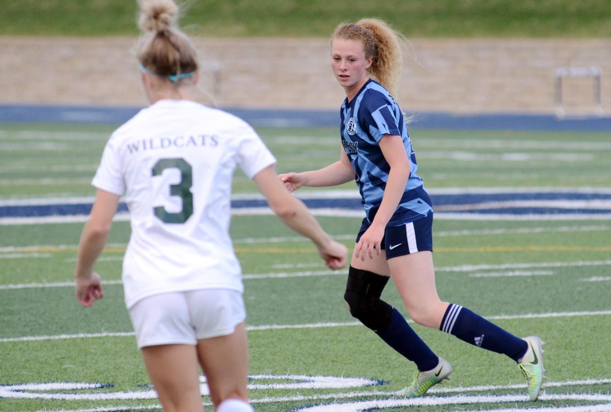 Petoskey's Hope Wegmann defends against an Alpena player with the ball during the first half of Tuesday's game.