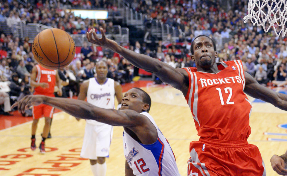 Los Angeles Clippers guard Eric Bledsoe, left, blocks the shot of Houston Rockets guard Patrick Beverley during the first half of their NBA basketball game, Wednesday, Feb. 13, 2013, in Los Angeles. (AP Photo/Mark J. Terrill)