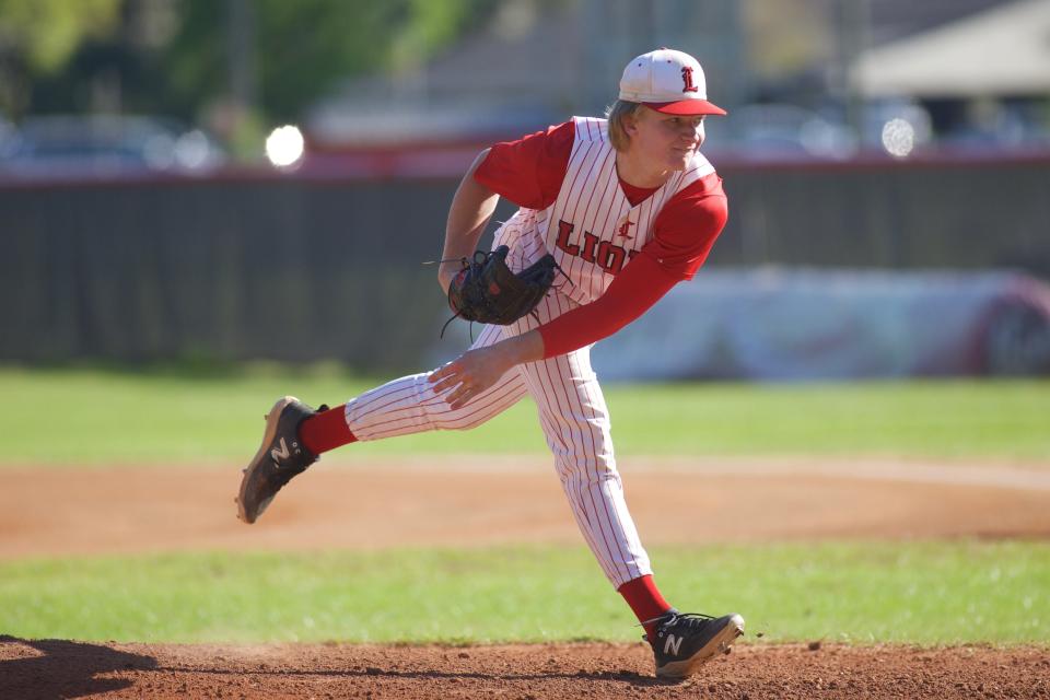 Leon junior Chase Davis (4) throws a pitch in a game between Leon and Mosley on March 21, 2023, at Leon High School. The Lions won 3-2.