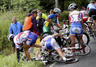Taiwan's Hsiao Mei Yu (58), South Korea's Na Ah-reum (54), Brazil's Fernanda da Silva Souza (40) and Venezuela's Danielys Garcia (47) try to recover from a crash during the Women's Road Race Road Cycling Day 2 of the London 2012 Olympic Games on July 29, 2012 in London, England. (Photo by Stefano Rellandini - IOPP Pool Getty Images)