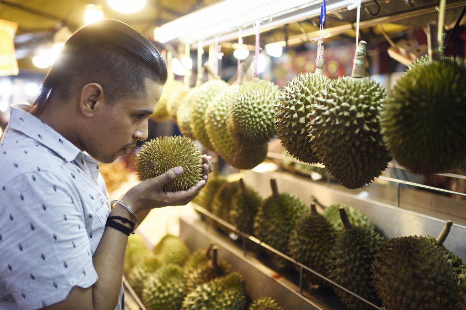 Man smelling durian