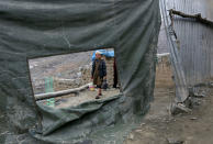 <p>A boy fetches water to his home, on the outskirts of Kabul, Afghanistan, Feb. 28, 2017. (AP Photo/Rahmat Gul) </p>