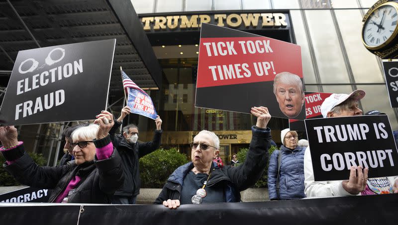 Protesters gather outside Trump Tower on Friday, March 31, 2023, in New York. Former President Donald Trump was indicted by a Manhattan grand jury on Thursday.