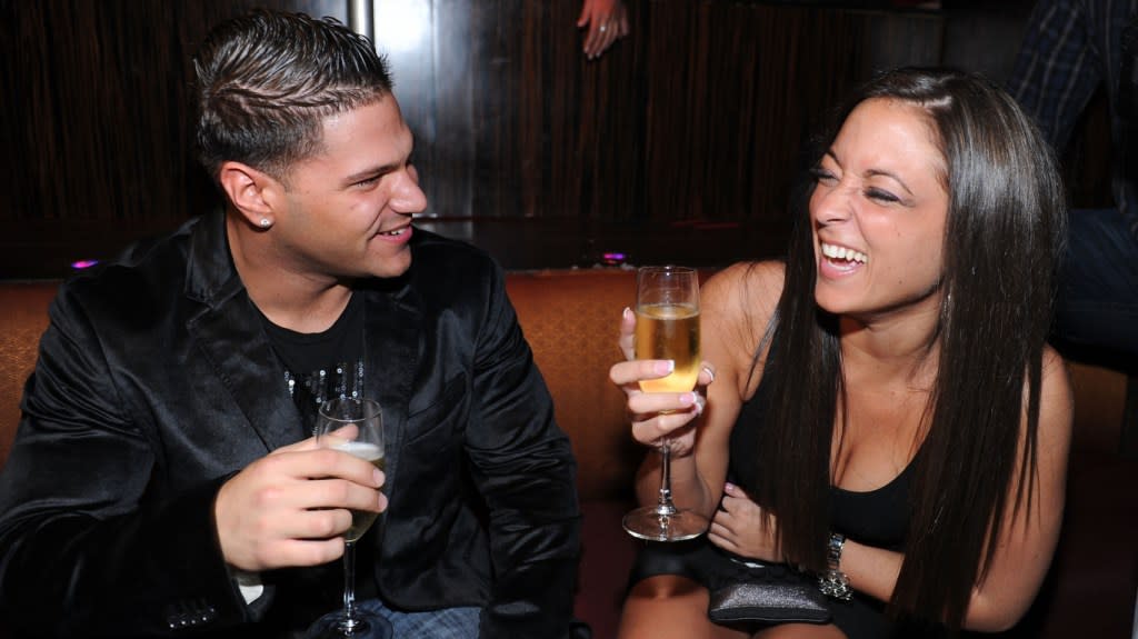 Ronnie Ortiz-Magro and Sammi Sweetheart smiling with champagne glasses