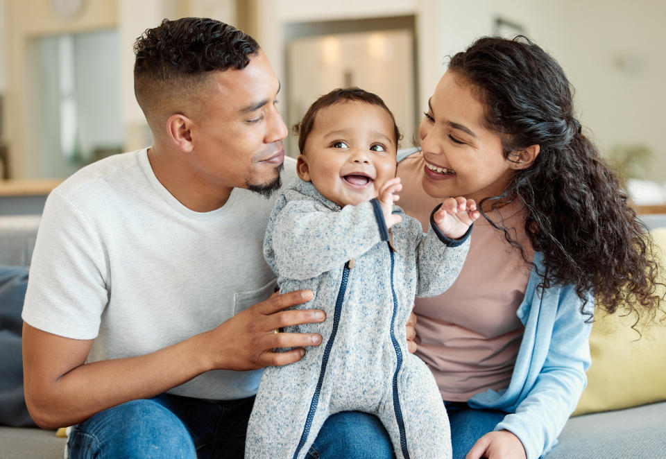 a couple hanging with their baby