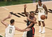May 17, 2019; Milwaukee, WI, USA; Toronto Raptors forward Kawhi Leonard (2) passes the ball away from Milwaukee Bucks center Brook Lopez (11) in the third quarter in game two of the Eastern conference finals of the 2019 NBA Playoffs at Fiserv Forum. Mandatory Credit: Benny Sieu-USA TODAY Sports