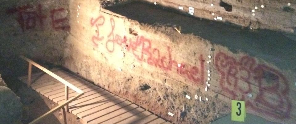 This undated image provided by the Bureau of Land Management shows the vandalized Hidden Cave near Fallon, Nev. Federal officials are offering a $1,000 reward after someone spray-painted phrases at the archaeological site. Public tours to Hidden Cave are temporarily suspended while law enforcement investigates. (AP Photo/Bureau of Land Management)