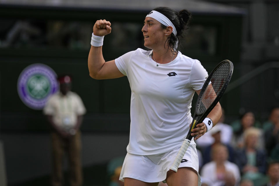 Tunisia's Ons Jabeur celebrates after winning a point against Marie Bouzkova of the Czech Republic in a women's singles quarterfinal match on day nine of the Wimbledon tennis championships in London, Tuesday, July 5, 2022. (AP Photo/Alastair Grant)