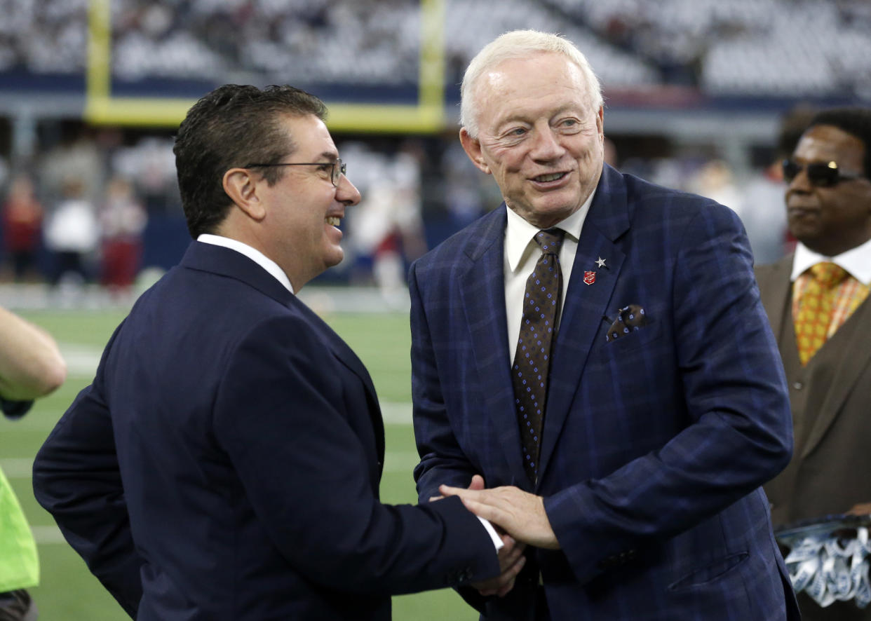 Washington Redskins owner Danile Snyder, left, and Dallas Cowboys owner Jerry Jones, right, greet each other before an NFL football game, Thursday, Nov. 24, 2016, in Arlington, Texas. (AP Photo/Michael Ainsworth)