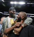 LeBron James embraces Chris Paul following an NBA basketball game between the Brooklyn Nets and the Miami Heat, Wednesday, April 10, 2019, in New York. The pair, along with Carmelo Anthony, were in New York to watch Dwyane Wade's final NBA game. (AP Photo/Kathy Willens)