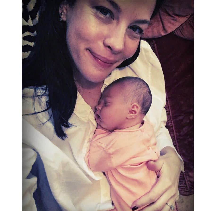 Proud new mom Liv Tyler shared an aww-inducing first snap of herself cradling her newborn daughter Lula. The 38-year-old mom-of-three, who welcomed her first daughter just days ago, shared the adorable snap with the caption "ohhhhh little Lula!!!!!" on July 21, 2016.