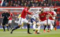 <p>Tottenham Hotspur’s Son Heung-Min,shields the ball from Chris Smalling</p>