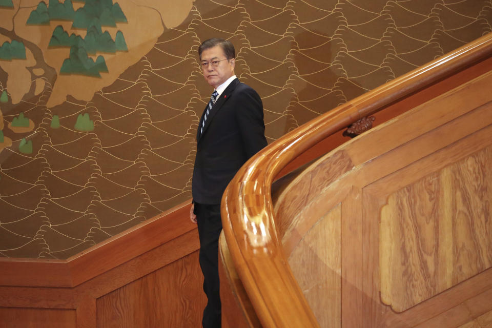 South Korean President Moon Jae-in arrives for his New Year's speech at the presidential Blue House in Seoul, South Korea, Tuesday, Jan. 7, 2020. Moon said he hopes to see North Korean leader Kim Jong Un fulfill a promise to visit the South this year as he called for the rival Koreas to end a prolonged freeze in bilateral relations. (Lee Jin-wook/Yonhap via AP)