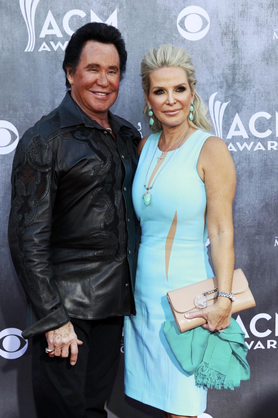 Singer Wayne Newton and his wife Kathleen McCrone arrive at the 49th Annual Academy of Country Music Awards in Las Vegas, Nevada April 6, 2014. REUTERS/Steve Marcus (UNITED STATES - Tags: ENTERTAINMENT)(ACMAWARDS-ARRIVALS)