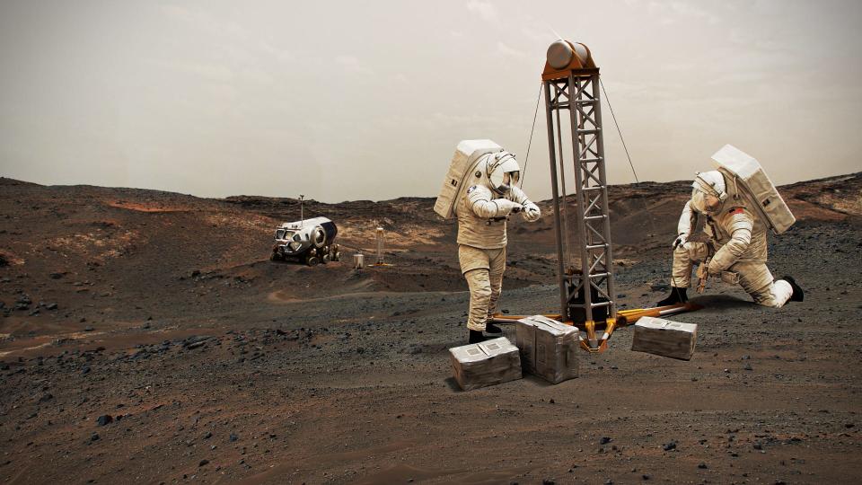 illustration shows astronauts using equipment on mars