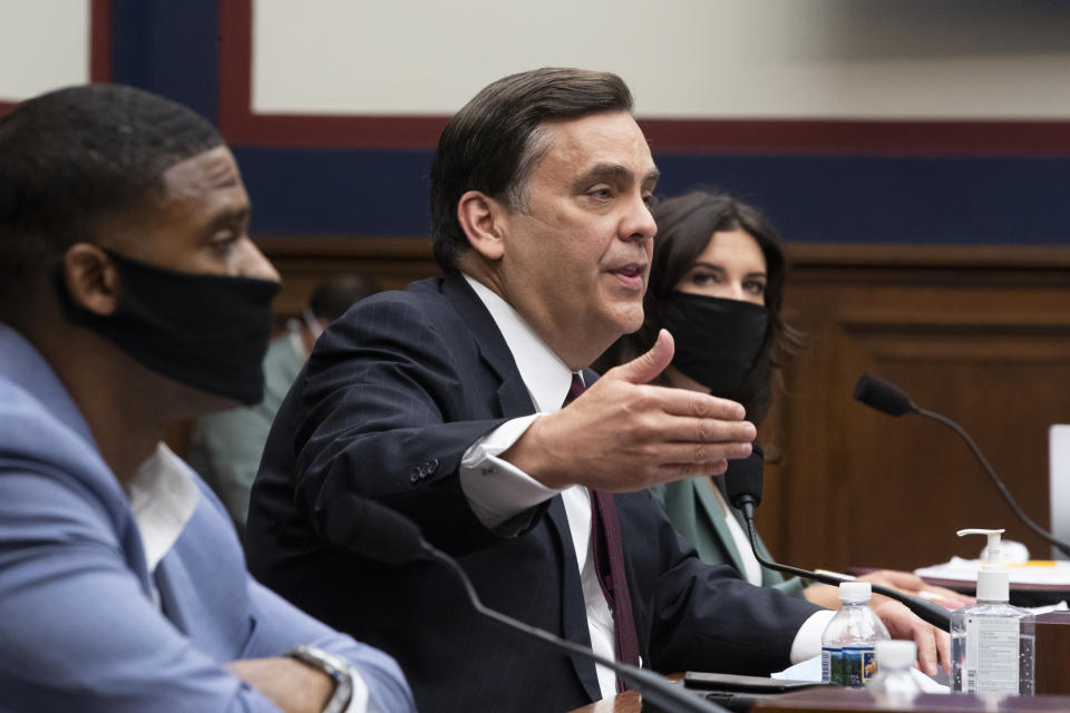 George Washington University Law School Law Professor Jonathan Turley, center, testifies beside U.S. Navy veteran and Black Lives Matter protester Kishon McDonald, left, and Amelia Brace of Australia's Seven News, Monday, June 29, 2020, on Capitol Hill in Washington, during the House Natural Resources Committee hearing on the police response in Lafayette Square. (Michael Reynolds/Pool via AP)