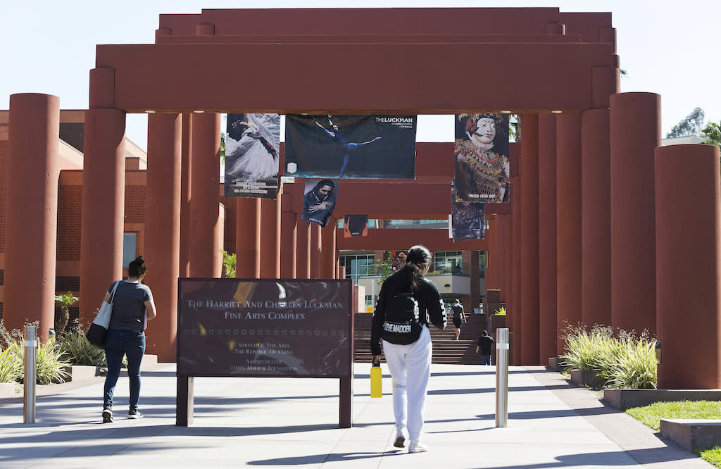 Students walk past the Harriet and Charles Luckman Fine Arts Complex at the California State University, Los Angeles campus on April 25, 2019