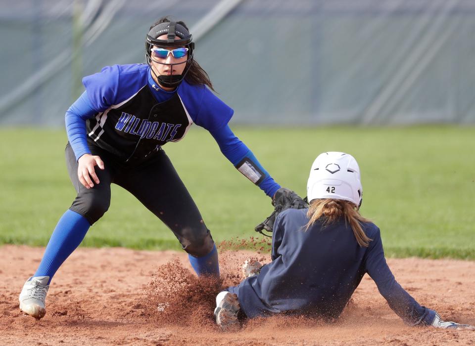 Oshkosh West's Brianna Bougie tags out Appleton North's Meg Carew during their softball game on April 21 in Appleton.