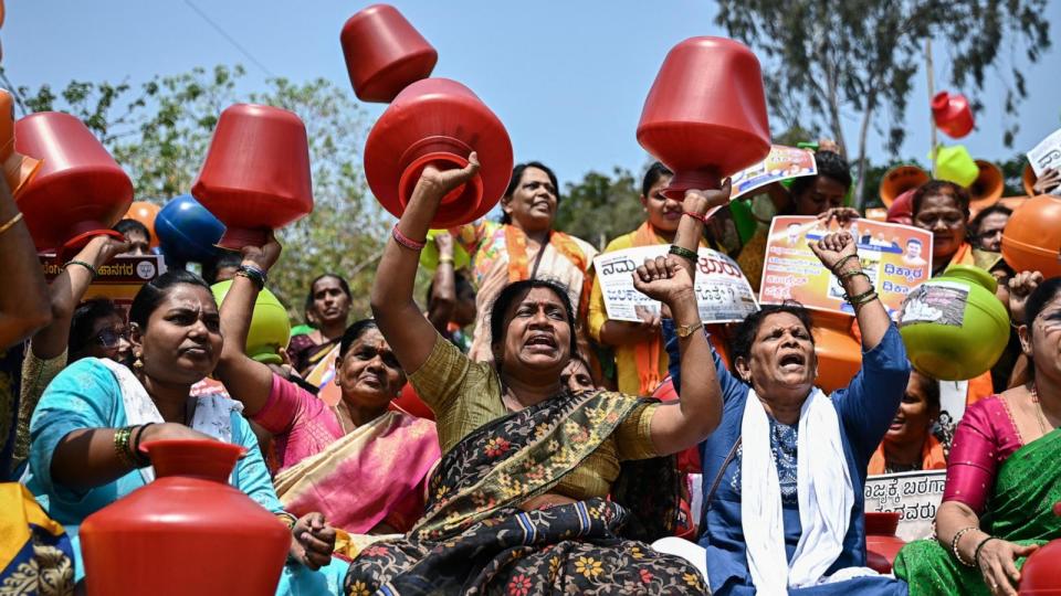 PHOTO: Activists and members of the Bharatiya Janata Party (BJP) hold empty water pots during a protest against the state government over ongoing severe water crisis, in Bengaluru on March 12, 2024.  (Idrees Mohammed/AFP via Getty Images)