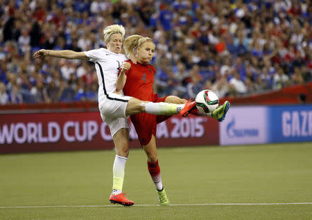 Jun 30, 2015; Montreal, Quebec, CAN; United States midfielder Megan Rapinoe (15) and Germany defender Leonie Maier (4) play the ball during the second half of the semifinals of the FIFA 2015 Women's World Cup at Olympic Stadium. Michael Chow-USA TODAY Sports