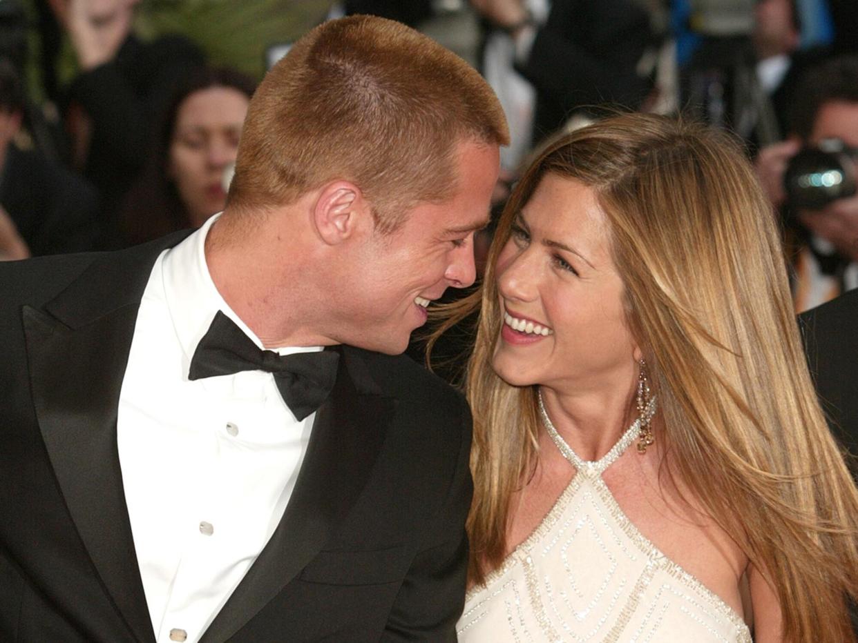 Brad Pitt and wife actress Jennifer Aniston attend the World Premiere of the epic movie "Troy" at Le Palais de Festival on May 13, 2004 in Cannes, France