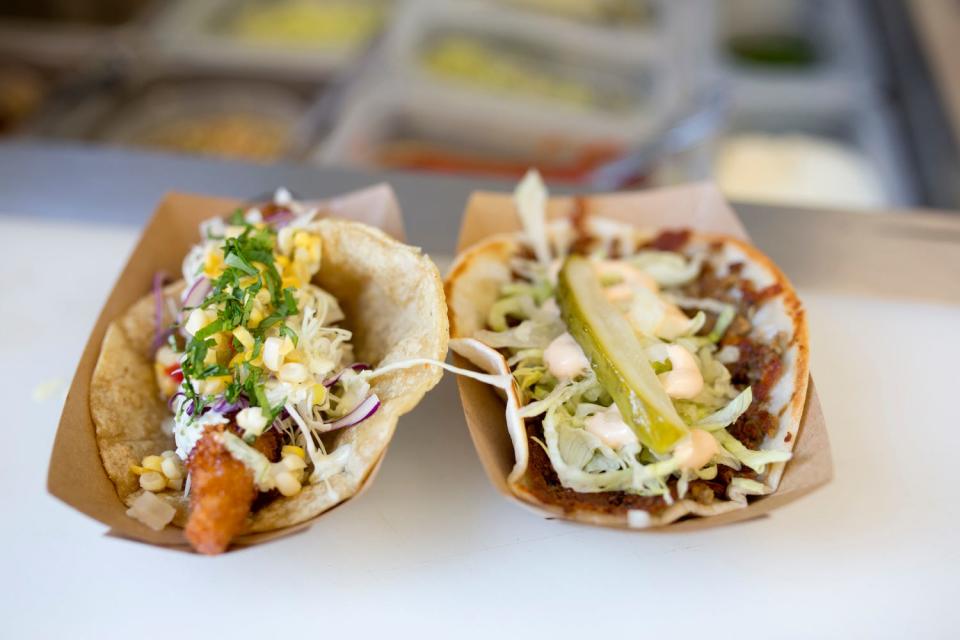 A pair of freshly made tacos by Happy's Taco.