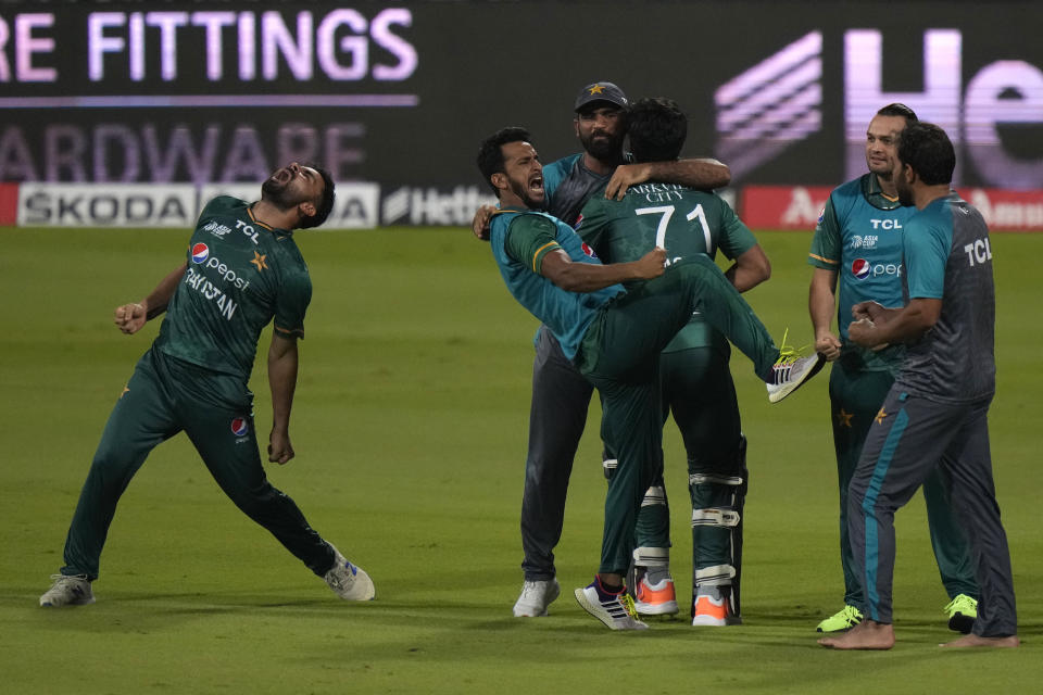 Pakistan's players celebrate their win in the T20 cricket match of Asia Cup against Afghanistan, in Sharjah, United Arab Emirates, Wednesday, Sept. 7, 2022. (AP Photo/Anjum Naveed)