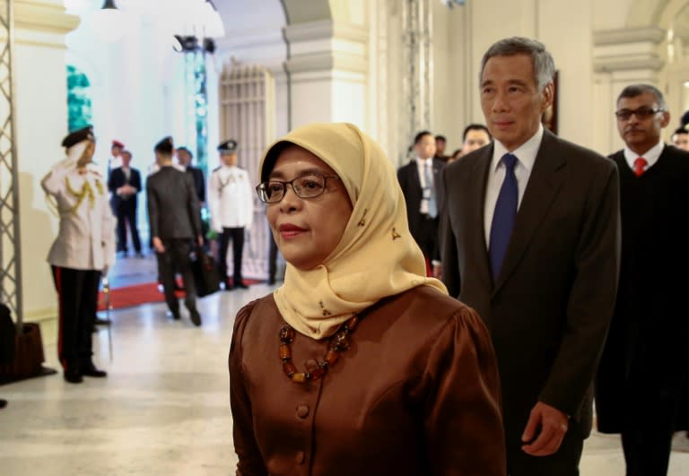 Photo of President Halimah Yacob (foreground) and Prime Minister Lee Hsien Loong (behind Halimah): AFP