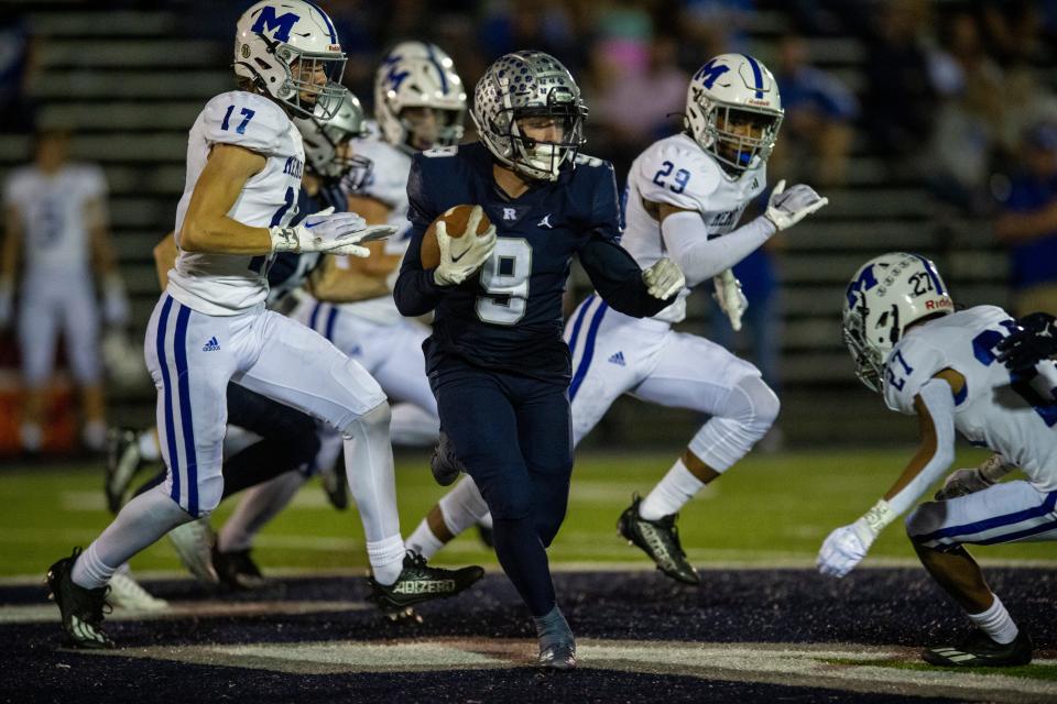 Reitz’s Roland Vera Jr. (9) runs the ball as the Reitz Panthers play the Memorial Tigers at the Reitz Bowl in Evansville, Ind., Friday Sept. 29, 2023.