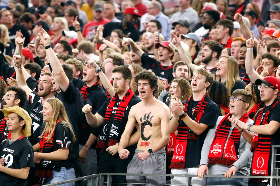 Cincinnati fans cheer during the first half of the Cotton Bowl NCAA College Football Playoff semifinal game against Alabama, Friday, Dec. 31, 2021, in Arlington, Texas. (AP Photo/Michael Ainsworth)