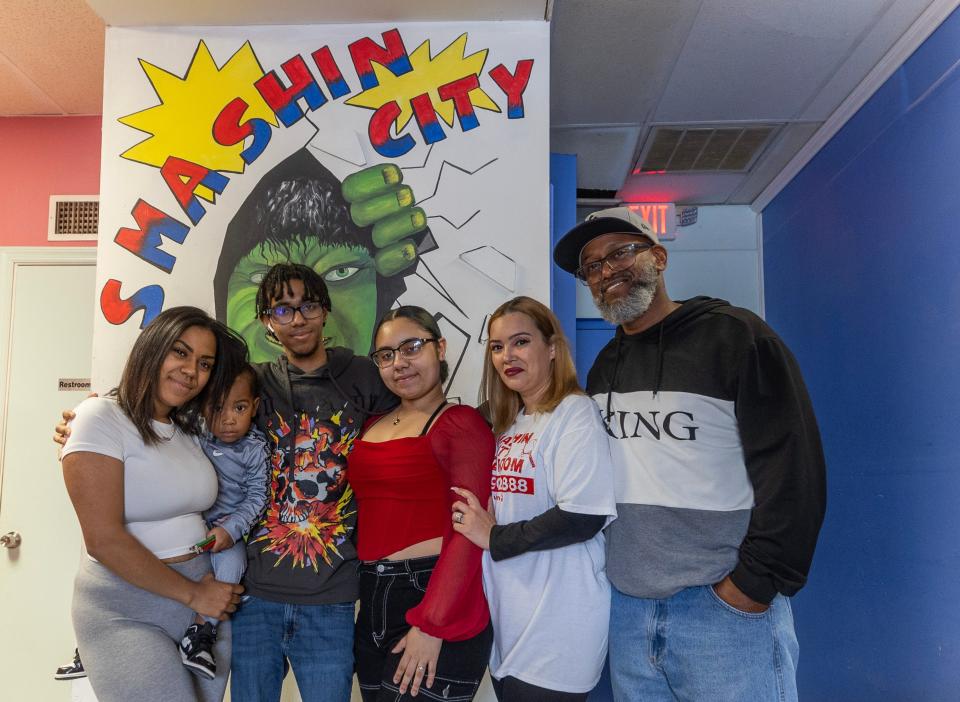 The staff at Smashin City Rage Room: (left to right) Aneesa Toney, Cahdir Boone, Jovanni Montes, Jade Lusa Clark, and owners Esther and Delovi Canales at the Toms River location.