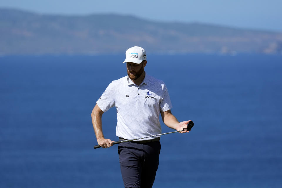 Chris Kirk watches his shot on the 14th green during the final round of The Sentry golf event, Sunday, Jan. 7, 2024, at Kapalua Plantation Course in Kapalua, Hawaii. (AP Photo/Matt York)