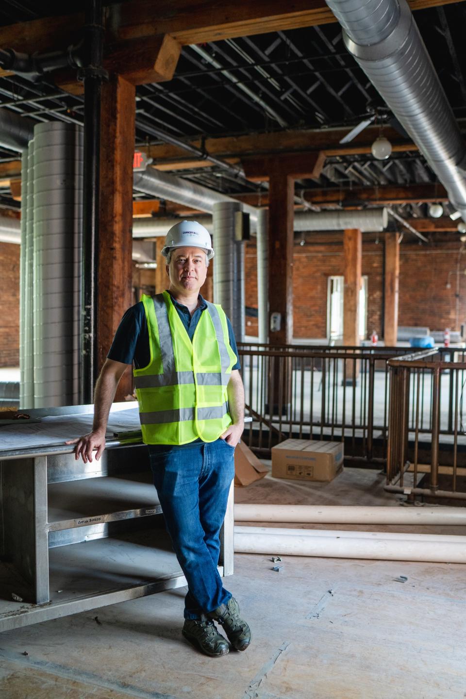Zach Liff, owner of DZL Management and Cannery Hall, poses for a photograph while construction remains ongoing in July 2023.