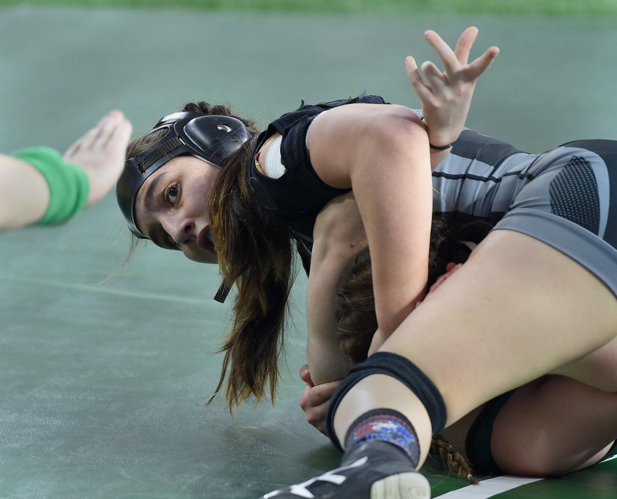 Milan's Angelina Pena pinned Tamari Khizanishvilli of West Bloomfield in the first period in the first round at 130-pounds Friday, March 1, 2024 at the MHSAA State Individual Wrestling Championships at Ford Field in Detroit.