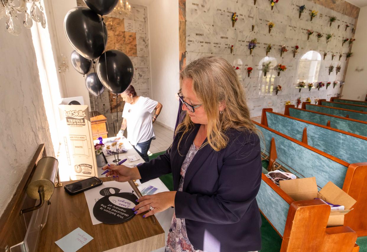 Family Service Manager Rachael Reimer with Good Shepherd Memorial Gardens in Ocala, Florida, fills out a black balloon for the Rodriguez family. Wednesday, March 6, 2024 marked Black Balloon Day. The event is to honor those who have died from drug overdoses. Drug overdose is the leading cause of accidental death in the United States. Opioid addiction is driving this epidemic. Black Balloon Day helps create awareness around the important issue of providing support to those struggling with substance use disorder and their loved ones.