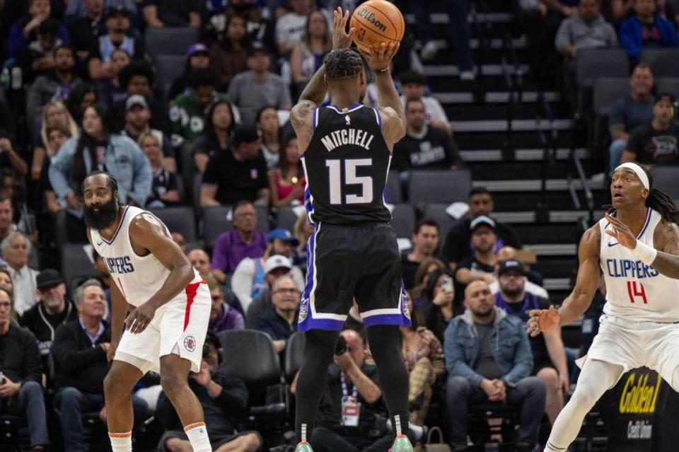 Sacramento Kings guard Davion Mitchell (15) hits a three point basket during an NBA game against the Los Angeles Clippers on Tuesday, April 2, 2024, at Golden 1 Center. Hector Amezcua/hamezcua@sacbee.com