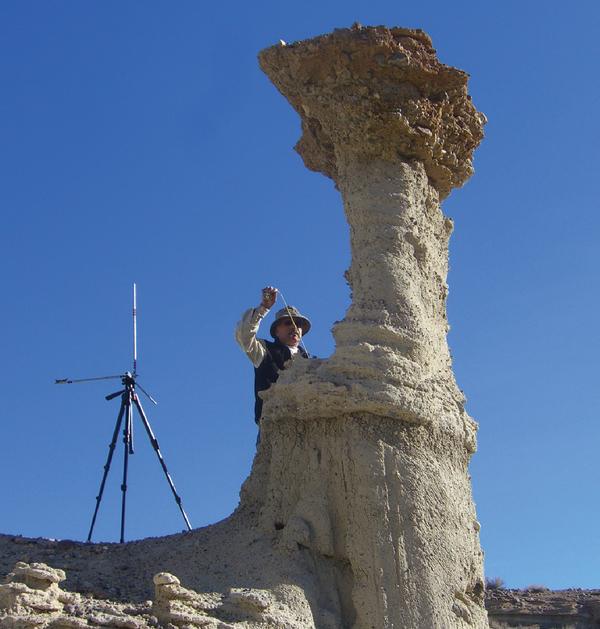 A scientist measuring a hoodoo in Red Rock Canyon, Calif. The strange rock formation could provide clues to shaking during past earthquakes.