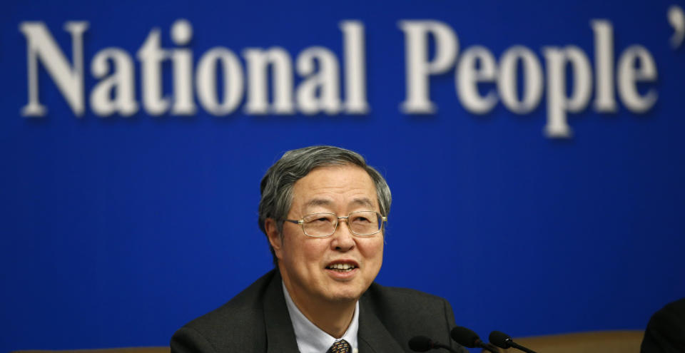 People's Bank of China governor Zhou Xiaochuan speaks at a press conference during the National People's Congress at the media center in Beijing, China, Tuesday, March 11, 2014. Zhou said Beijing might finish the process of easing controls on interest rates within two years and market forces will set the pace for allowing use of its tightly controlled currency abroad. (AP Photo/Vincent Thian)