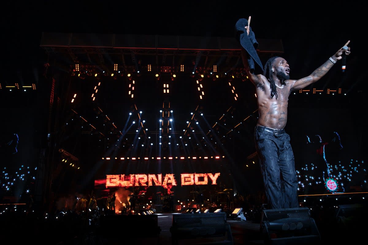 Burna Boy rose to international fame with his distinctive sound that blends Afrobeat, reggae, dancehall, and other musical genres (Afro Nation 2023)