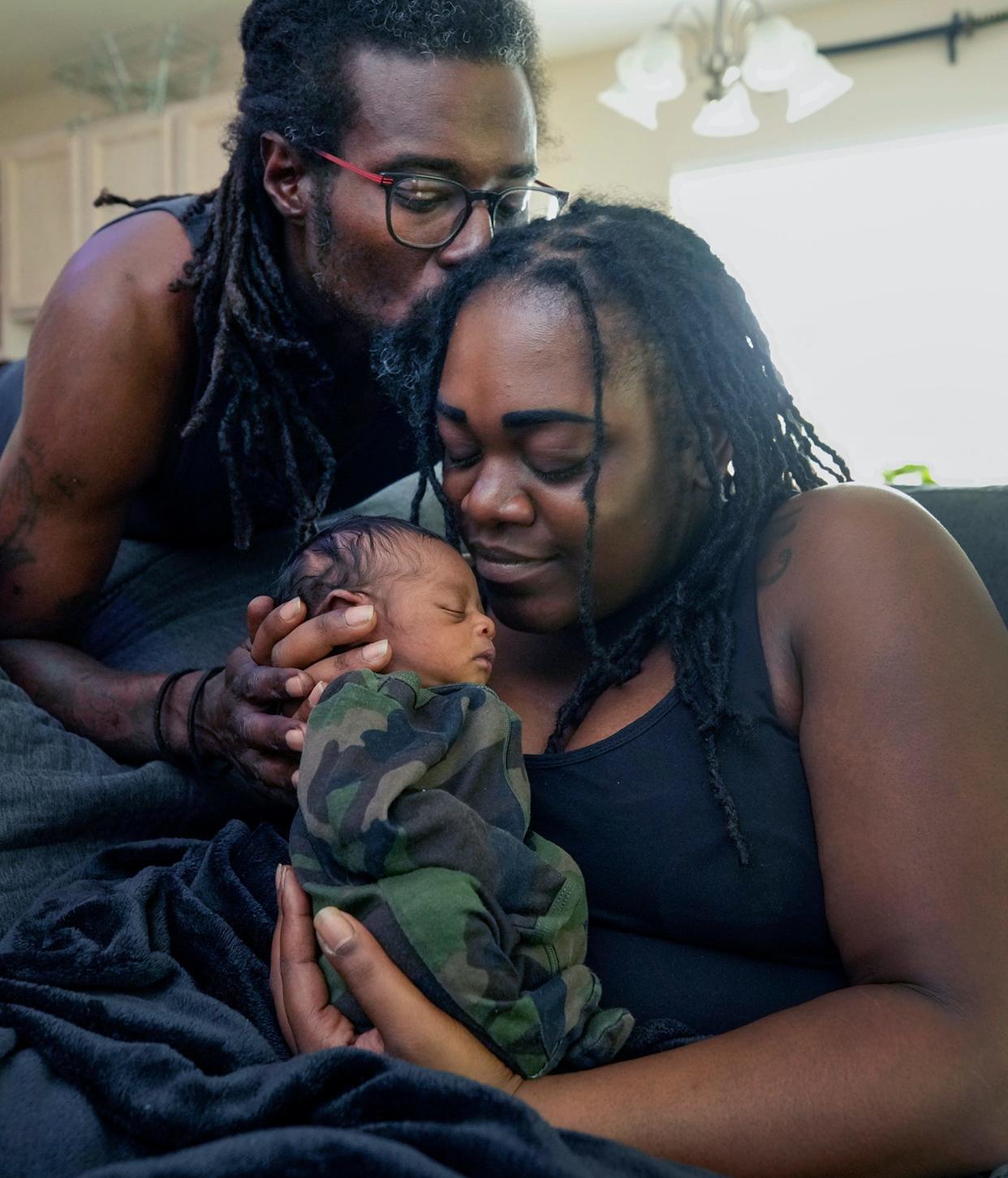 Anthony and Isis Davis with their newborn son Akovi at their Palm Coast home, Monday, July 2, 2023.