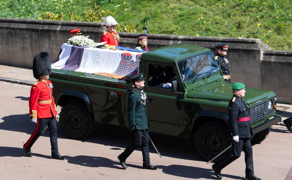 WINDSOR, ENGLAND - APRIL 17: The Duke of Edinburgh’s coffin, covered with His Royal Highness’s Personal Standard is seen on the purpose built Land Rover, during the funeral of Prince Philip, Duke of Edinburgh on April 17, 2021 in Windsor, England.   Prince Philip of Greece and Denmark was born 10 June 1921, in Greece. He served in the British Royal Navy and fought in WWII. He married the then Princess Elizabeth on 20 November 1947 and was created Duke of Edinburgh, Earl of Merioneth, and Baron Greenwich by King VI. He served as Prince Consort to Queen Elizabeth II until his death on April 9 2021, months short of his 100th birthday. His funeral takes place today at Windsor Castle with only 30 guests invited due to Coronavirus pandemic restrictions. (Photo by Pool/Samir Hussein/WireImage)