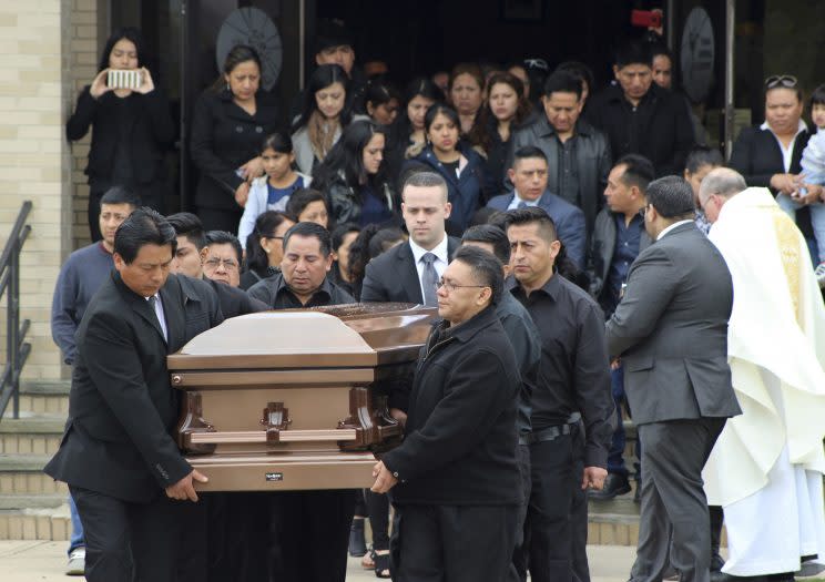 In this April 19, 2017 file photo, the casket of Justin Llivicura, 16, is carried from St. Joseph the Worker Church after Llivicura's funeral in East Patchogue, N.Y. Llivicura, 16, was one of four young men found slain in a suspected MS-13 gang killing in a park in Central Islip, N.Y., on April 12. (Photo: Frank Eltman/AP)