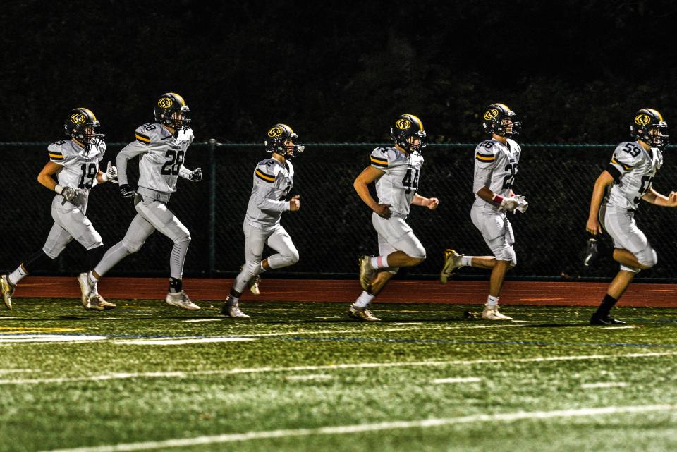 High School football game between Cresskill at Park Ridge on Friday October 25, 2019. Cresskill runs onto the field prior to the game. 