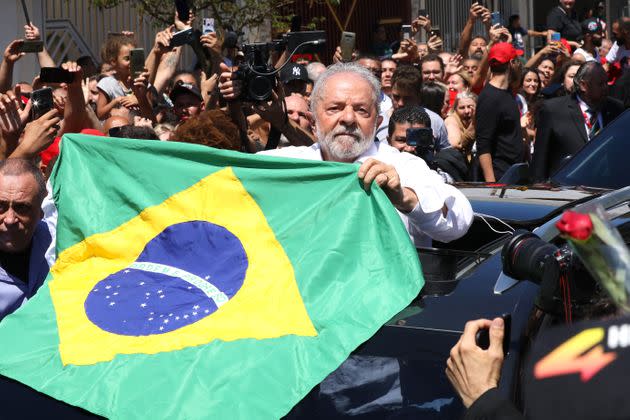 Candidate Luiz Inácio Lula Da Silva of Workers’ Party greets supporters as he leaves Escola Estadual Firmino Correia De Araújo after casting his vote and giving a news conference Sunday in Sao Bernardo do Campo, Brazil. Brazilians vote for president again after neither Lula nor incumbent Jair Bolsonaro reached enough support to win in the first round. (Photo: Rodrigo Paiva via Getty Images)