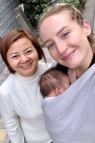 <p>Courtesy of Anastasia Koss</p> Anastasia Koss smiles with her confinement nurse and her baby girl