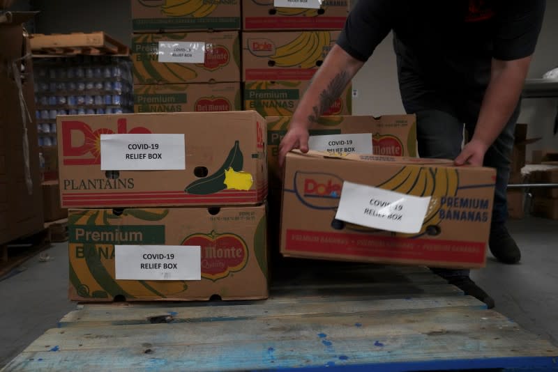 COVID-19 food relief boxes are being prepared at the South Texas Food Bank in Laredo, Texas