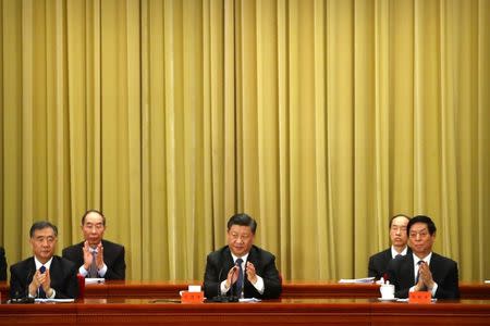 Chinese President Xi Jinping applauds during an event to commemorate the 40th anniversary of the "Message to Compatriots in Taiwan" at the Great Hall of the People in Beijing, China January 2, 2019. REUTERS/Mark Schiefelbein/Pool